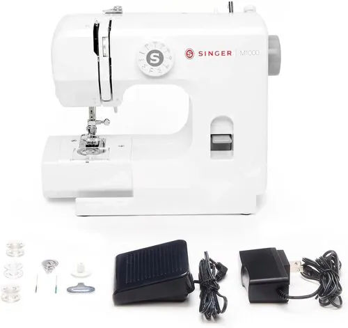 White Singer M1000 sewing machine with stitch dial, presser foot, bobbins, needles, foot pedal, and power adapter.