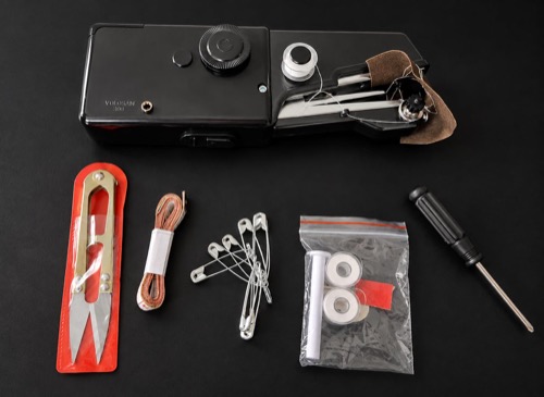 Customer-submitted black handheld sewing tool and repair accessories