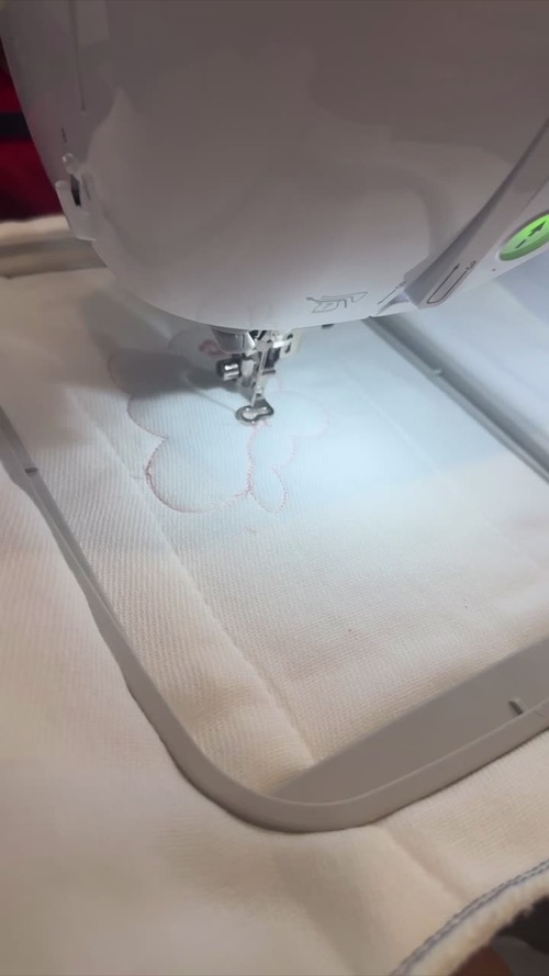 Brother PE900 embroidering a design inside a customer-hooped project