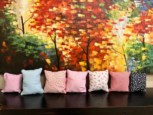 Small fabric pillows photographed by a Royalsellpro customer