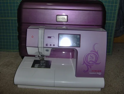 The 9985 in an owner-purchased carrying case; the case is not part of the machine’s standard package.