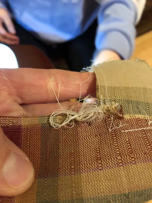 Tangled thread on fabric shown by an M3500 customer reporting repeated stitching problems; the cause cannot be diagnosed from the photo alone.