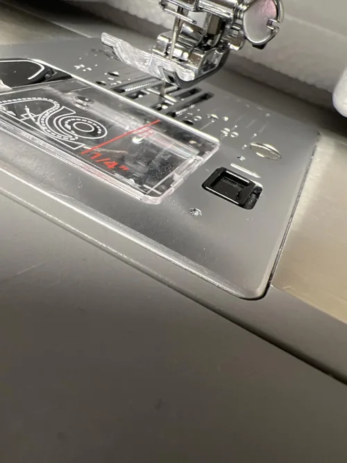 The bobbin area photographed by an owner reporting thread and tension problems.