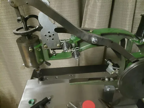 ColouredPeas patcher head and handwheel mounted on its metal base