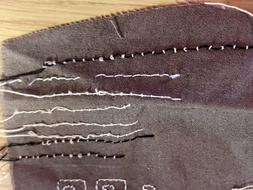 Stitching photographed by an SE9180 owner reporting tension problems.