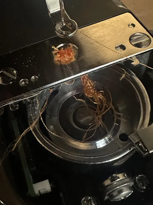 The Skitch bobbin area photographed by an owner reporting mechanical difficulties.