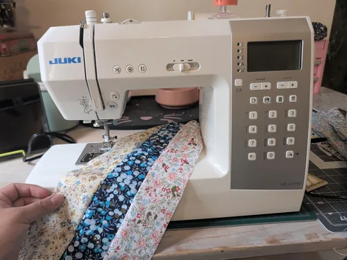 A Juki HZL-HT740 owner sewing patterned fabric.