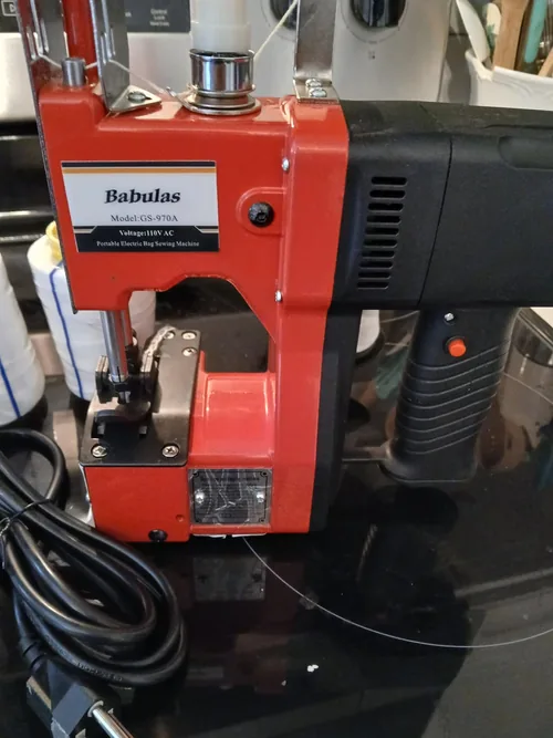 Red Babulas bag closer with its GS-970A and 110 V AC label visible