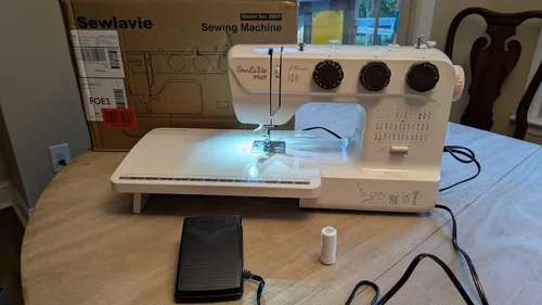 Customer photo of the 996P and extension table. This reviewer also reports poor lighting and awkward storage access.