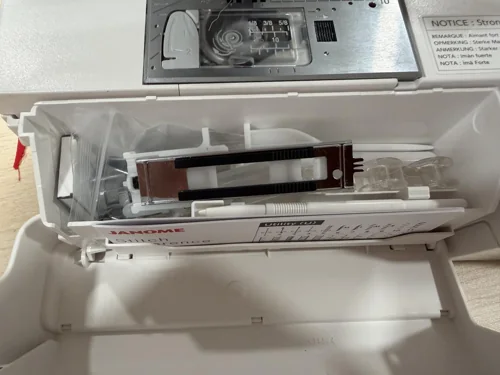 Open accessory compartment on a Janome Memory Craft 1000